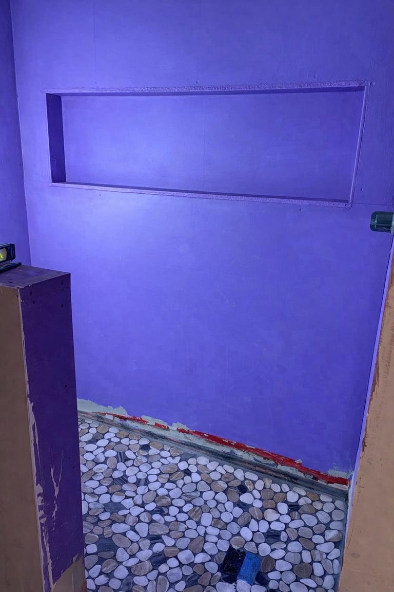 Purple lit room with white circular floor tiles and rectangular shelf on wall
